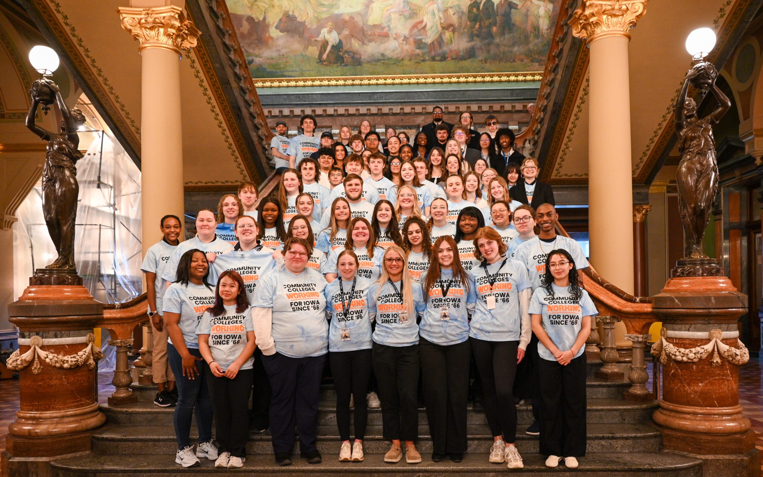 Large group wearing matching blue shirts